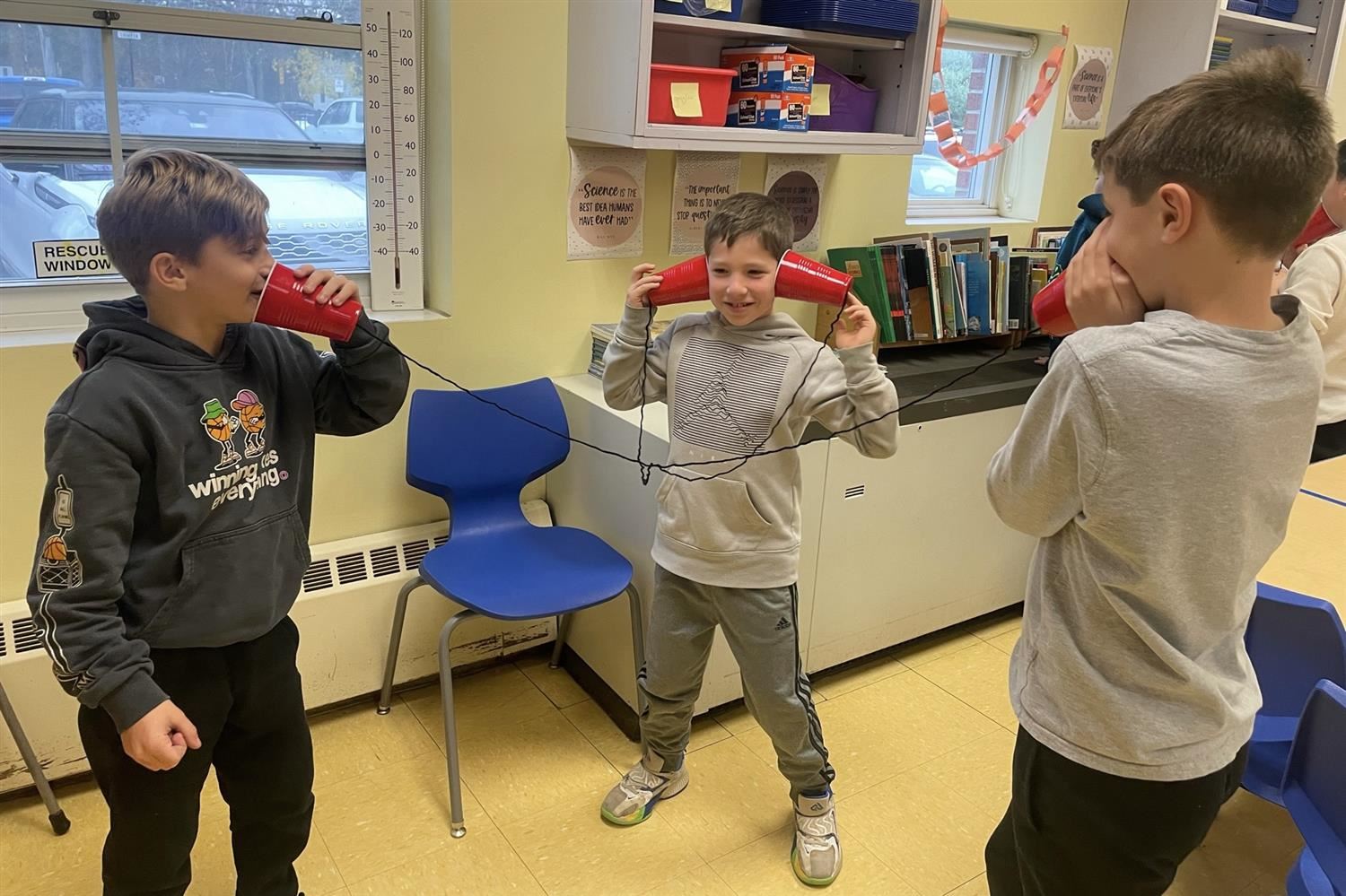  kids with string telephones